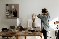 Kaboompics - Sunlit Interior Design Studio with Material Samples and Designer