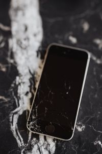 Kaboompics - Broken Mobile on Marble Table