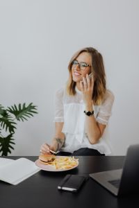 Kaboompics - Businesswoman Speaking on Phone Beside Laptop and Lunch