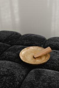 Kaboompics - Minimal Wooden Bowl on a Black Textured Ottoman