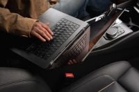 Kaboompics - Woman Working on a Laptop in a Cozy Car Interior