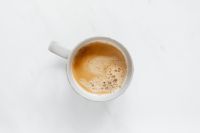 Kaboompics - Overhead Coffee Cup on White Marble with Bright Copy Space