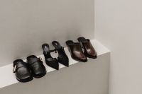 Kaboompics - Row of Black and Brown Shoes on White Shelf