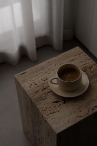 Kaboompics - Minimalist Coffee Cup on Stone Table by Window