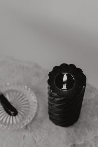 Kaboompics - Top View of Black Candle Flame and Incense Dish on Marble, Dark Still Life