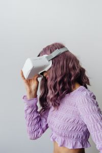 Kaboompics - Young Woman in Neon Clothing Using Virtual Reality Goggles