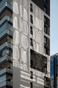 Kaboompics - Apartment Building with Reflected Light Patterns
