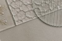 Kaboompics - Overlapping Textured Glass Panels on Gray Ribbed Background