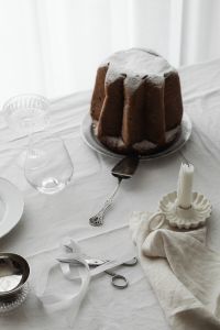 Kaboompics - Overhead Christmas Table Detail with Panettone, Cake Server and Ribbon