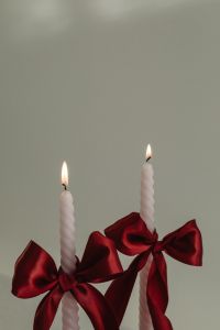 Kaboompics - Pair of White Candles with Red Satin Bows