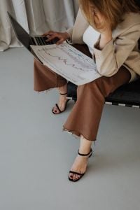 Kaboompics - Close View of Businesswoman Reviewing a Graph at Her Laptop