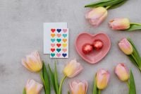 Kaboompics - Valentine Card With Tulips and Heart Chocolates on Gray Surface