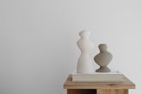 Kaboompics - Minimalist Oak Side Table with Sculptural Ceramic Vases and Art Book