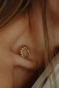 Kaboompics - Gold Circular Jewelry Detail on Skin