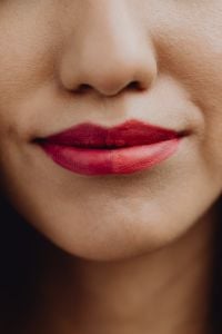 Kaboompics - Vertical Macro Portrait of Red Lipstick and Asian Woman's Lips