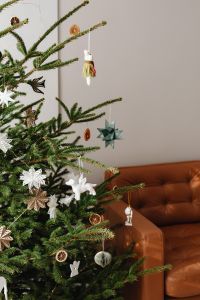 Kaboompics - Decorated Christmas Tree beside Brown Leather Armchair