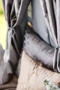 Kaboompics - Close-Up of Layered Patterned Balcony Cushions and Soft Curtains