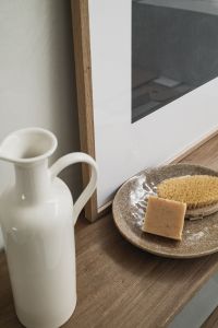 Kaboompics - Wooden Bench with Ceramic Vase, Soap and Body Brush