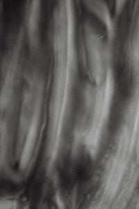 Kaboompics - Grayscale Skincare Cream with Smooth Raised Ridges, Monochrome Macro Texture