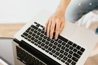 Kaboompics - Close-Up of Hands Typing on a Laptop at Home, Minimal Work-from-Home Background for Web Design