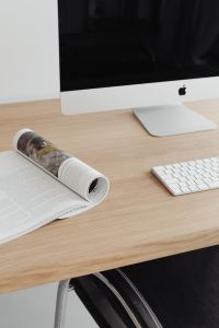 Kaboompics - Creative Workspace with Open Design Magazine, iMac and White Keyboard