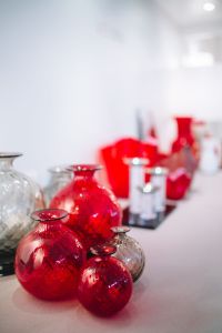 Kaboompics - Red Murano Glass Vases in a Soft-Focus Showroom Display