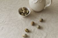 Kaboompics - Ceramic Easter Pitcher with Quail Eggs on Linen