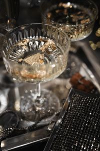 Kaboompics - Champagne Coupe With Gold Confetti And Silver Party Details
