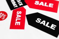 Kaboompics - Red and Black Sale Tags on White Background for Retail Promotion