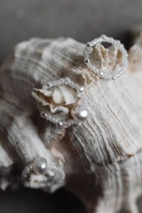 Kaboompics - Pearl Bead Loops with Large Pearls on a Ridged Seashell, Macro Still Life