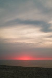 Kaboompics - Red Sunset Over a Dark Ocean Horizon