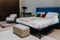 Kaboompics - Contemporary Bedroom with Blue Bed, Tufted Bench and Accent Armchair