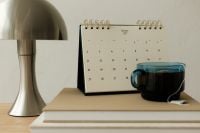Kaboompics - January 2027 Calendar With Lamp Green Tea and Books
