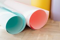 Kaboompics - Pastel Paper Rolls Scattered on a Light Wood Floor