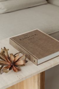 Kaboompics - Minimalist Book and Dried Flower Flat Lay with Copy Space on a Sofa