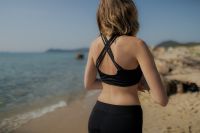 Kaboompics - Woman in Black Activewear by the Shore