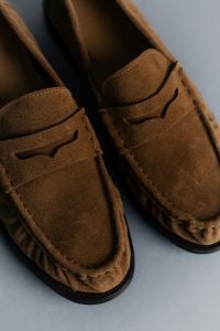 Kaboompics - Close-Up of Brown Suede Loafers on Blue Background