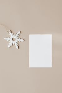 Kaboompics - Minimal White Christmas Card Mockup with Snowflake Ornament on Beige