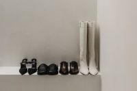 Kaboompics - Leather Shoes and White Boots in Minimal Display
