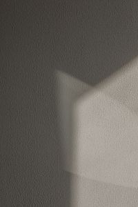 Kaboompics - Dark Gray Stucco Background with a Bright Diagonal Shadow