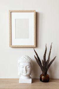 Kaboompics - Wooden Frame with White Buddha Head and Feather Vase, Neutral Decor Mockup
