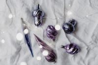 Kaboompics - Metallic Violet Ornaments with White Holiday Bokeh