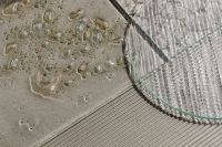 Kaboompics - Macro Glass Panel Edge over Parallel Ribbed Surface