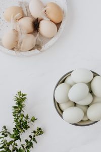 Kaboompics - Easter flat lay with green eggs on a white marble