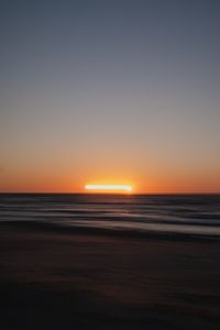 Kaboompics - Orange Sun Setting Over the Ocean Horizon