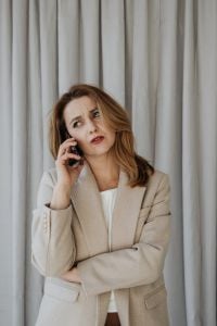 Kaboompics - Businesswoman Looking Up while Answering a Phone Call