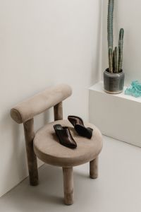 Kaboompics - Brown Leather Shoes on Stool Beside Cactus