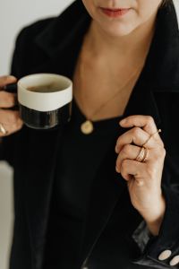Kaboompics - Woman Holding Coffee Cup and Showing Gold Rings