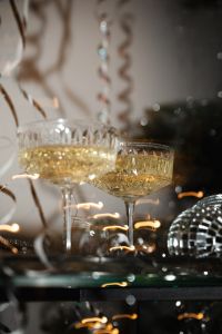 Kaboompics - Champagne Coupes and Disco Ball by a Festive Tree