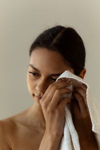 Kaboompics - Woman Drying Face with White Towel